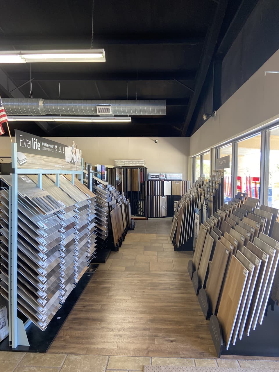 Everlife and COREtec luxury vinyl tile display aisle with Fuzion waterproof flooring at Somervell Floors
