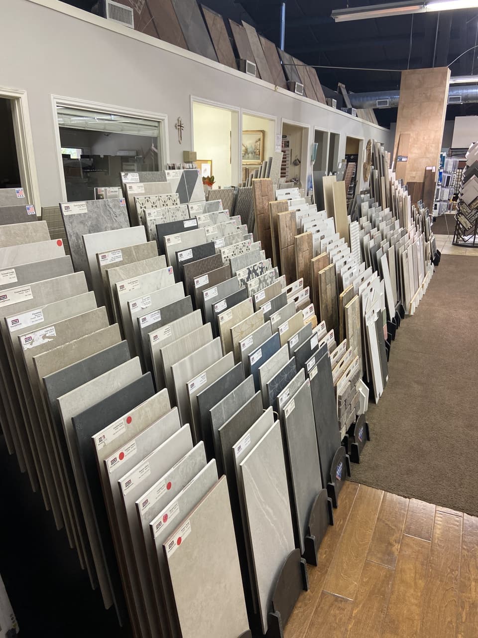 Acme Brick porcelain and wood-look tile showroom aisle in Granbury, TX