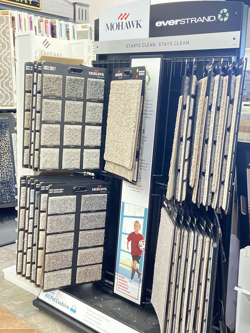 Mohawk Everstrand recycled-fiber carpet display with All Pet Cushion signage at Somervell Floors